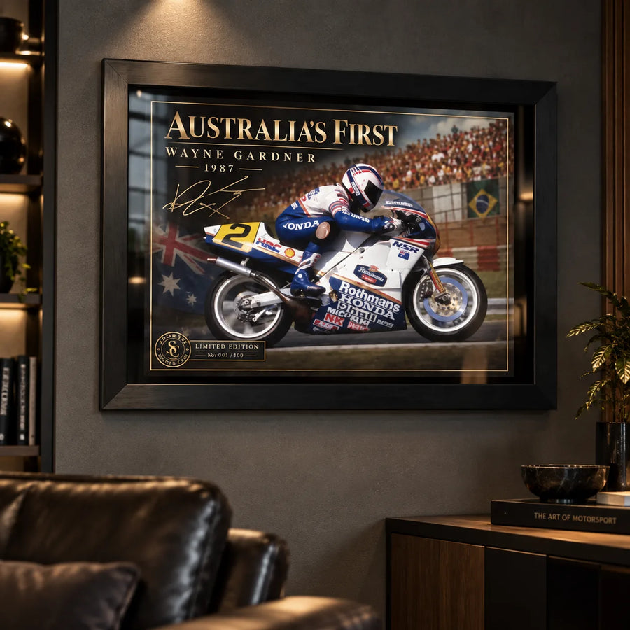 Wayne Gardner wall art displayed in a dark man cave setting with a black frame and premium motorsport collector styling.
