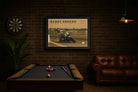 Barry Sheene framed wall art displayed in a UK style man cave with pool table and leather sofa.