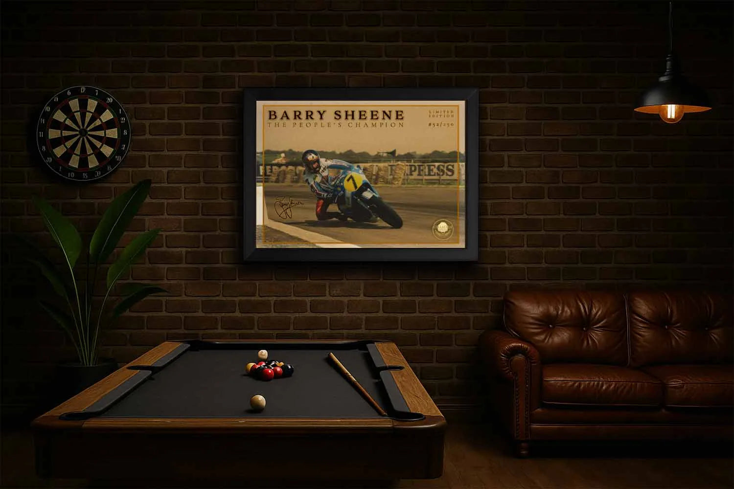 Barry Sheene framed wall art displayed in a UK style man cave with pool table and leather sofa.