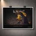 Unframed basketball print hanging with clips against a textured grey wall