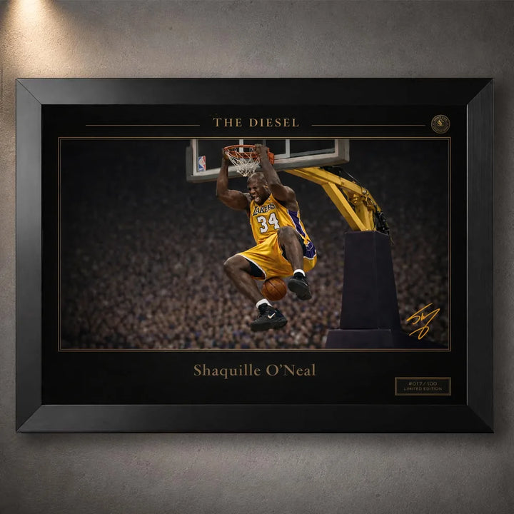 Black framed basketball wall art with gold collector details displayed on a textured grey wall