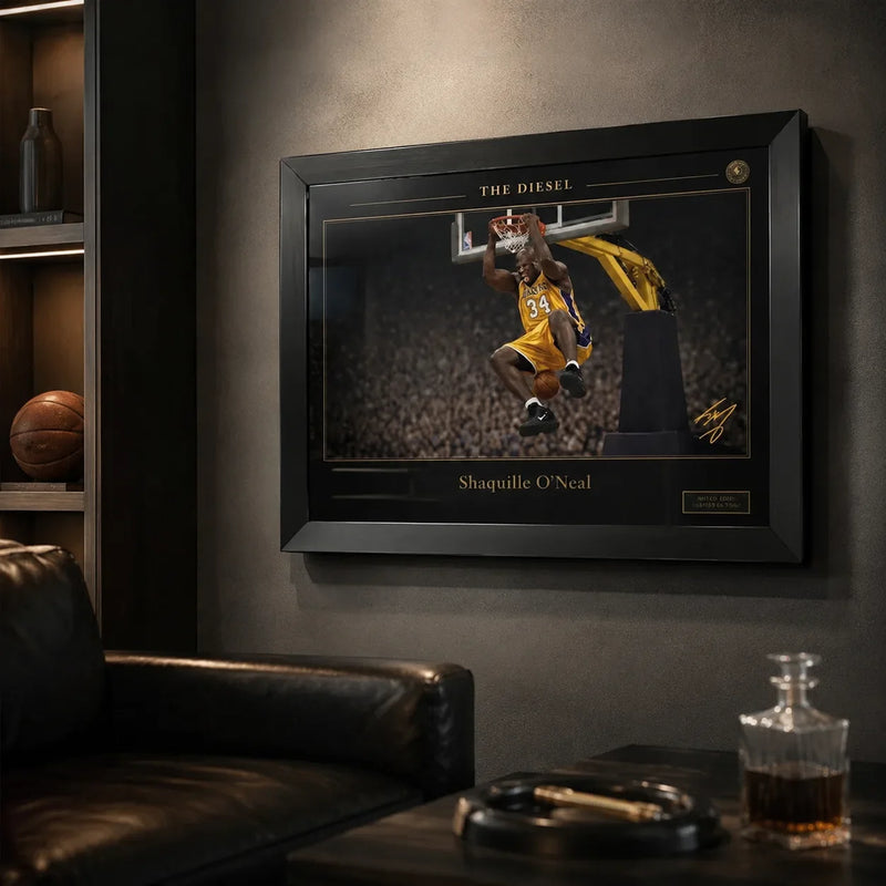 Black framed basketball wall art displayed in a dark premium man cave with leather seating