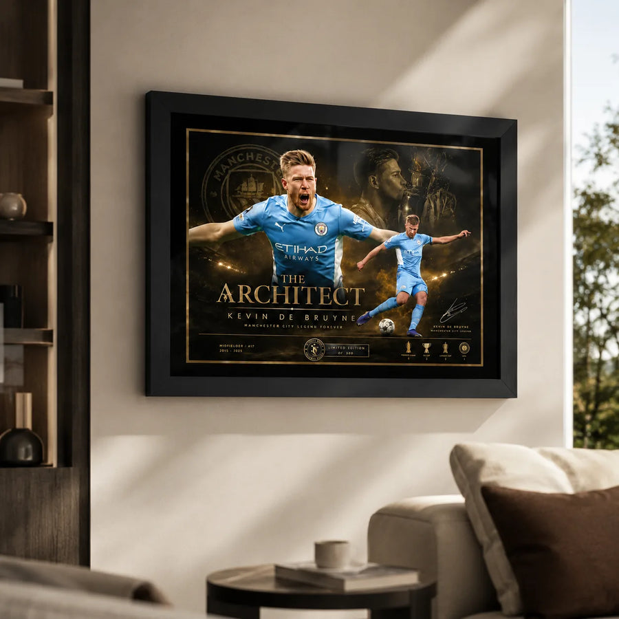Kevin De Bruyne Manchester City soccer wall art in a black frame on a bright living room wall.