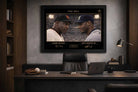 Executive office setting with framed sports memorabilia of Barry Bonds and Ken Griffey Jr. from The Era rivalry.