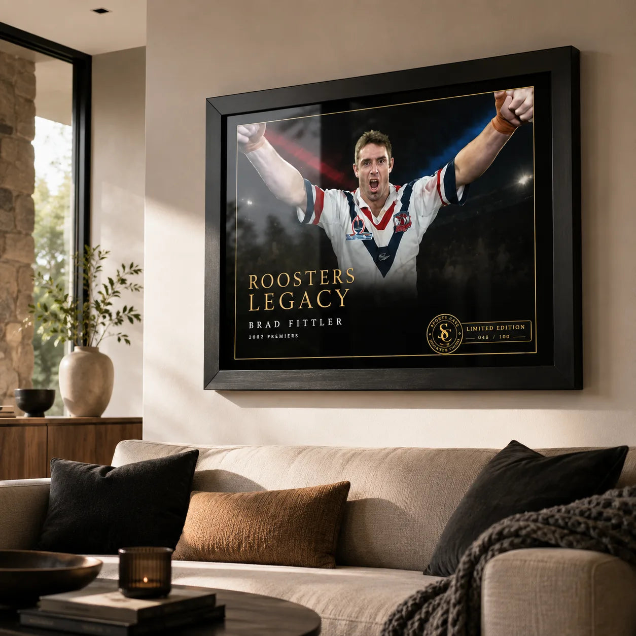 Brad Fittler wall art displayed in a contemporary living room, with the black framed Roosters Legacy tribute above a sofa.