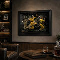 Black framed Brett Lee cricket wall art mounted in a dark collector-style man cave with illuminated shelving.