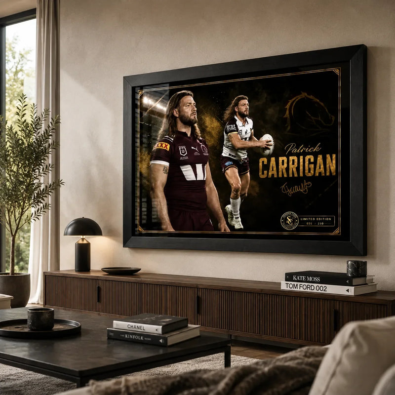 Patrick Carrigan Brisbane Broncos wall art in a warm modern living room, shown in a black frame above a timber console