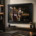 Patrick Carrigan Brisbane Broncos wall art in a modern office, displayed in a black frame above a timber credenza