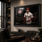 Black framed Bryce Harper baseball wall art displayed in a dark premium man cave with timber shelving.