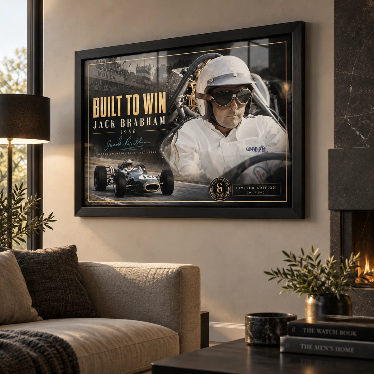 Black framed Jack Brabham Built To Win 1966 motorsport wall art displayed above a neutral sofa in a warm living room.