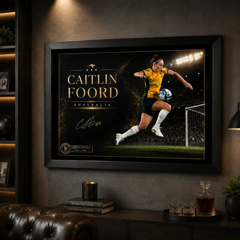 Caitlin Foord soccer wall art in a black frame displayed in a dark man cave with sports shelving and lounge seating.