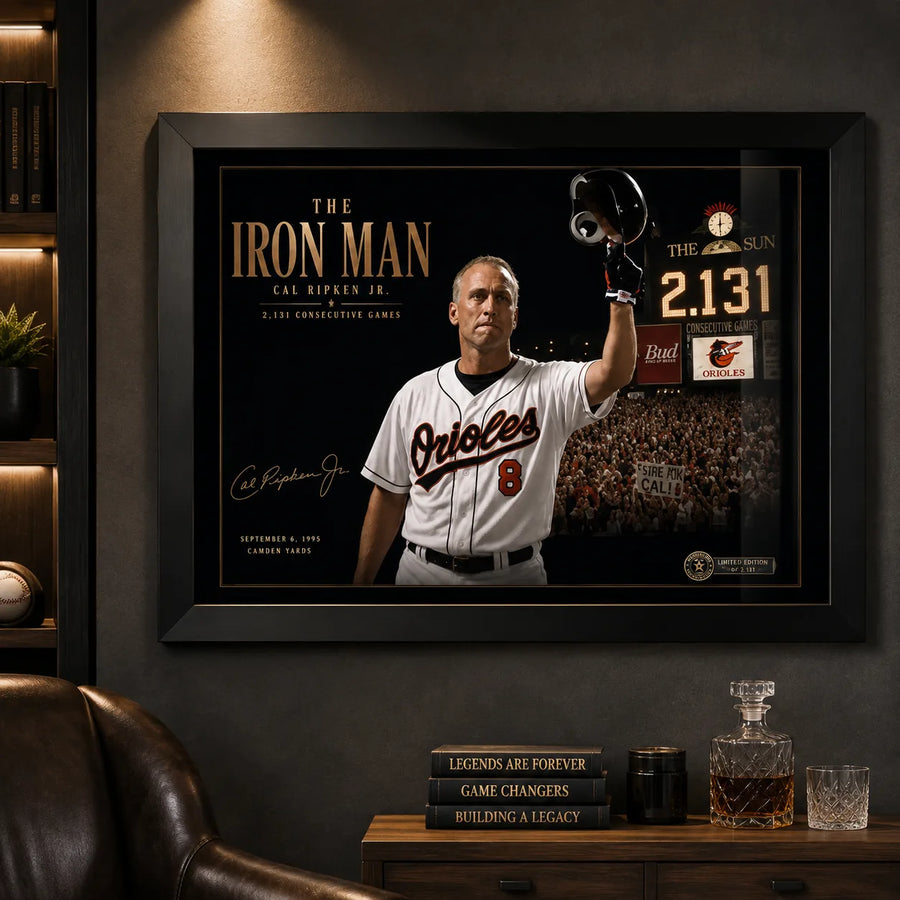 Black framed Cal Ripken Jr. baseball wall art displayed in a dark premium man cave with timber shelving.