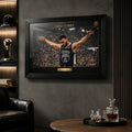 Chef Curry basketball wall art shown in a dark man cave setting with black frame and glass reflections.