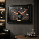 Chef Curry basketball wall art shown in a dark man cave setting with black frame and glass reflections.