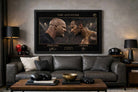Stone Cold vs The Rock wall art displayed in a modern man cave, bold framed sports art centerpiece above leather sofa