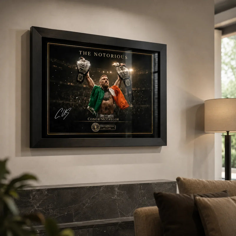 Conor McGregor wall art displayed in a bright premium living room above a dark stone console and neutral seating.
