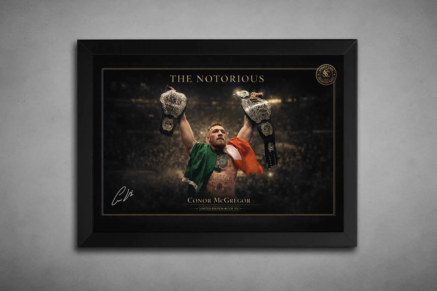 Conor McGregor holding championship belts in a black frame, premium framed sports art designed for bold man cave display.