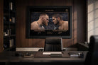 Executive office setting with framed sports memorabilia of Conor McGregor and Khabib Nurmagomedov from No Escape rivalry.