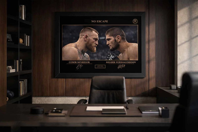 Executive office setting with framed sports memorabilia of Conor McGregor and Khabib Nurmagomedov from No Escape rivalry.