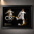Cristiano Ronaldo CR7 soccer wall art displayed in a black frame against a softly lit textured grey wall.