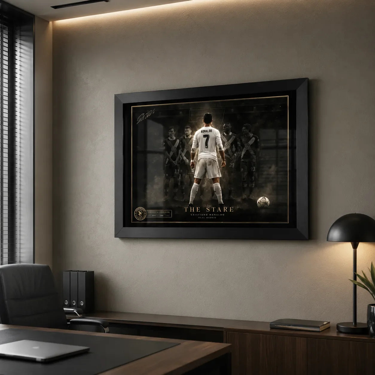 Cristiano Ronaldo framed sports art shown in a modern office with textured wall, desk and warm lighting