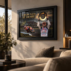 Casey Stoner wall art displayed in a warm living room, featuring the black framed Crowned at Home MotoGP design.