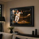 David Warner cricket wall art in a black frame displayed in a warm premium living room with restrained neutral decor.