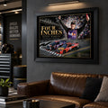 Denny Hamlin NASCAR wall art in a black frame above a brown leather sofa in a moody motorsport man cave.