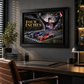 Black-framed Denny Hamlin Four Inches wall art hanging above a wooden desk in a dark modern office.