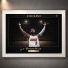 White framed basketball wall art with gold typography, arena lighting and textured wall backdrop.