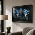 Erling Haaland Manchester City wall art in a black frame displayed on a warm modern living room wall.