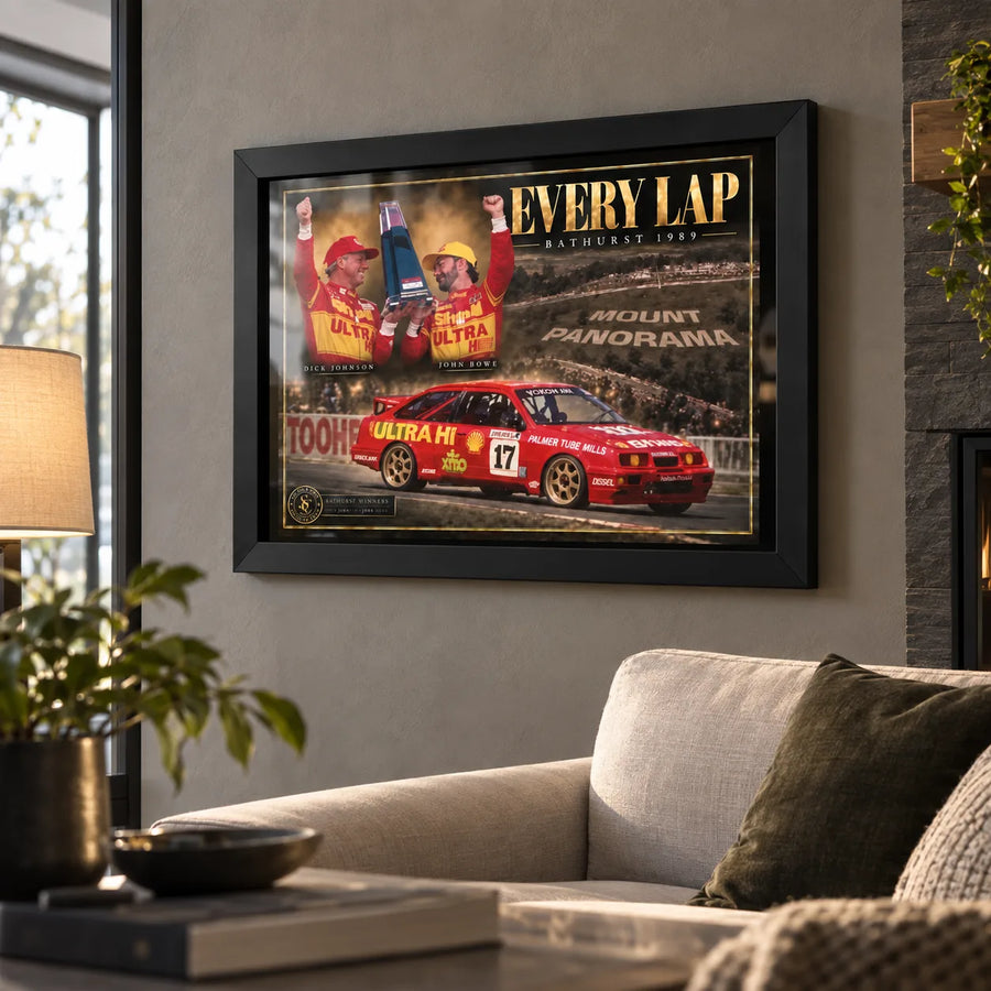 Black framed Every Lap Dick Johnson and John Bowe wall art displayed in a warm contemporary living room.