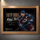 Oak framed Fifty-Three at Full Tilt Nathan MacKinnon hockey wall art shown against a dark textured wall.