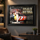 Darrell Waltrip NASCAR wall art displayed in a dark motorsport man cave with leather seating and collector styling.