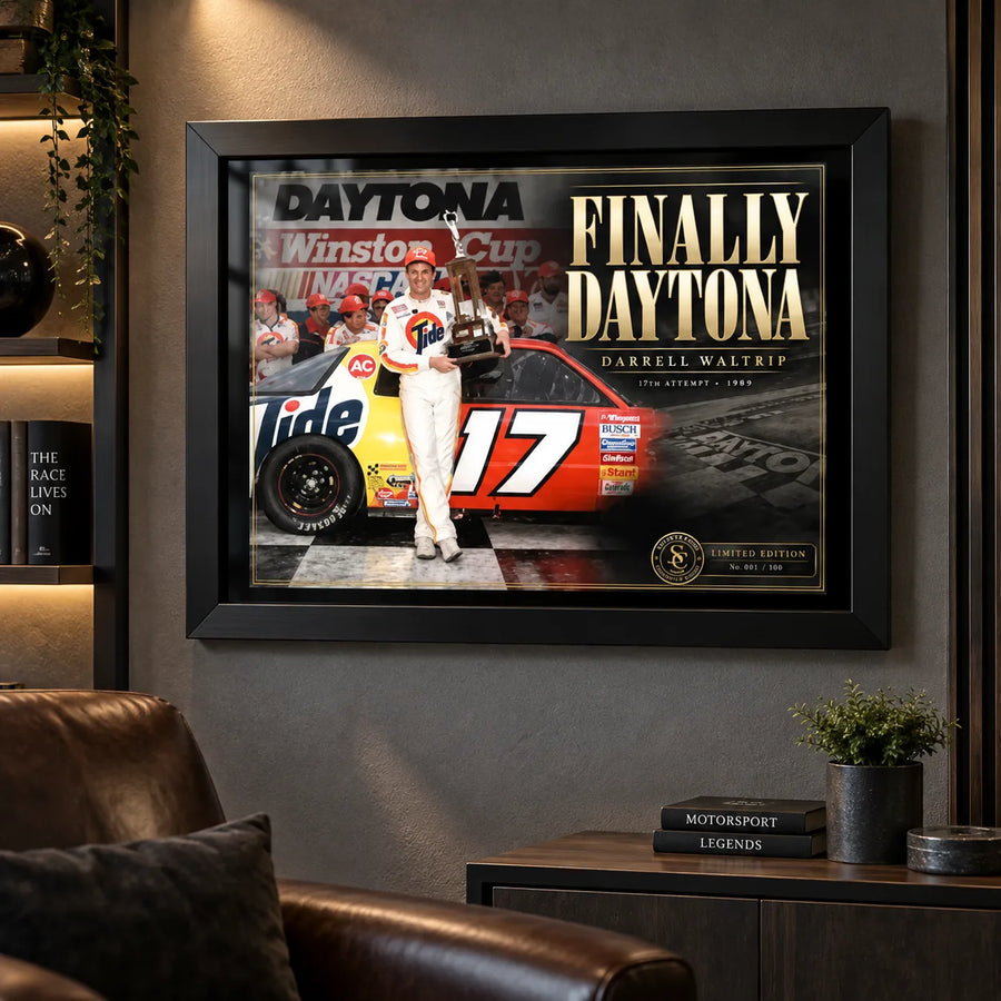 Darrell Waltrip NASCAR wall art displayed in a dark motorsport man cave with leather seating and collector styling.