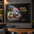 Mick Doohan Five Straight wall art displayed in a dark motorsport man cave with black frame and collector styling.