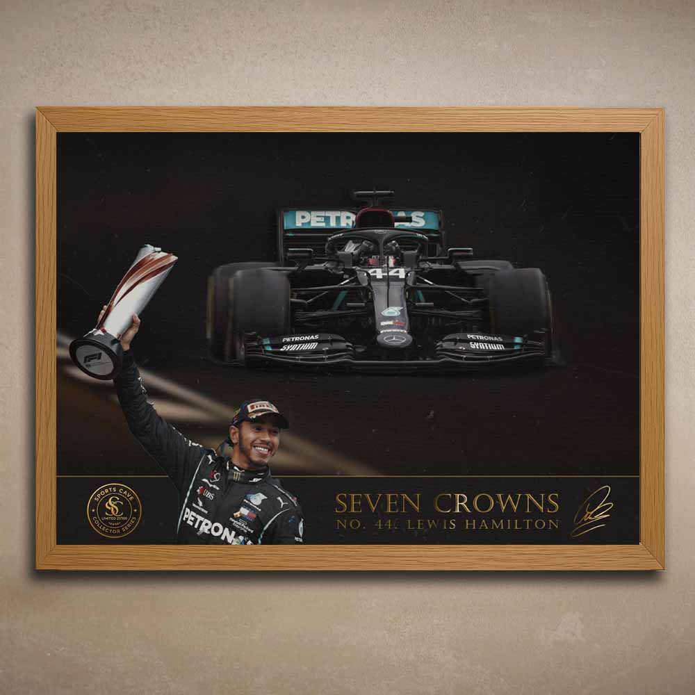 Oak framed poster of a Formula 1 car and a driver Lewis Hamilton, celebrating with a trophy, featuring 'Seven Crowns'.