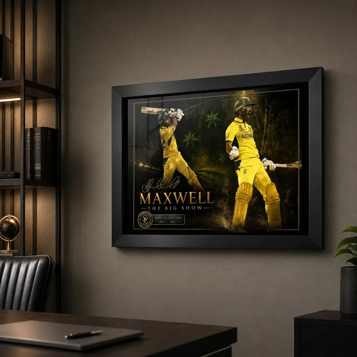 Glen Maxwell cricket wall art in a black frame mounted above a desk in a clean premium home office setting.