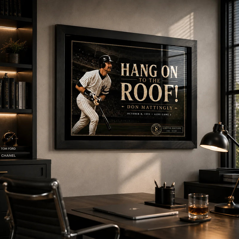 Don Mattingly wall art in a modern office setting, shown in a black frame above a desk with warm lighting.