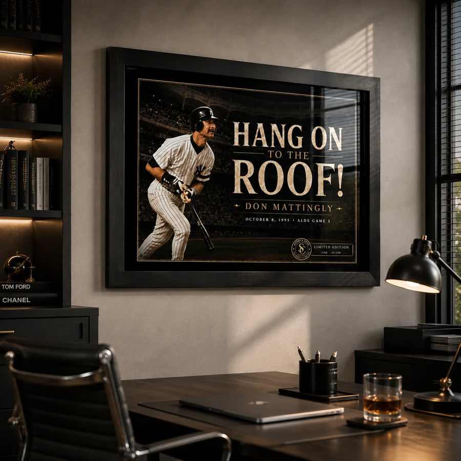 Don Mattingly wall art in a modern office setting, shown in a black frame above a desk with warm lighting.
