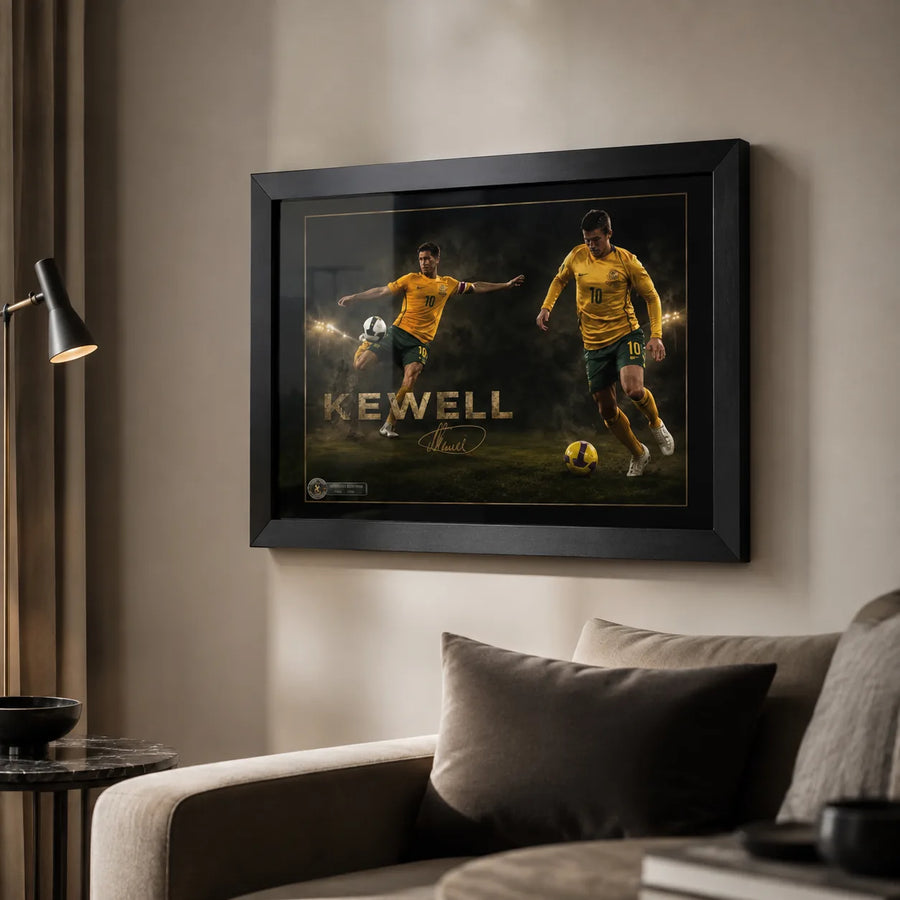 Harry Kewell soccer wall art displayed in a warm modern living room with a black frame above neutral seating.