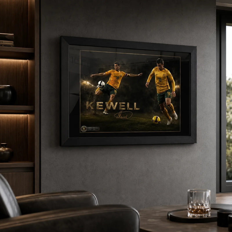 Black framed Harry Kewell soccer wall art displayed in a dark man cave with leather seating and illuminated shelving.
