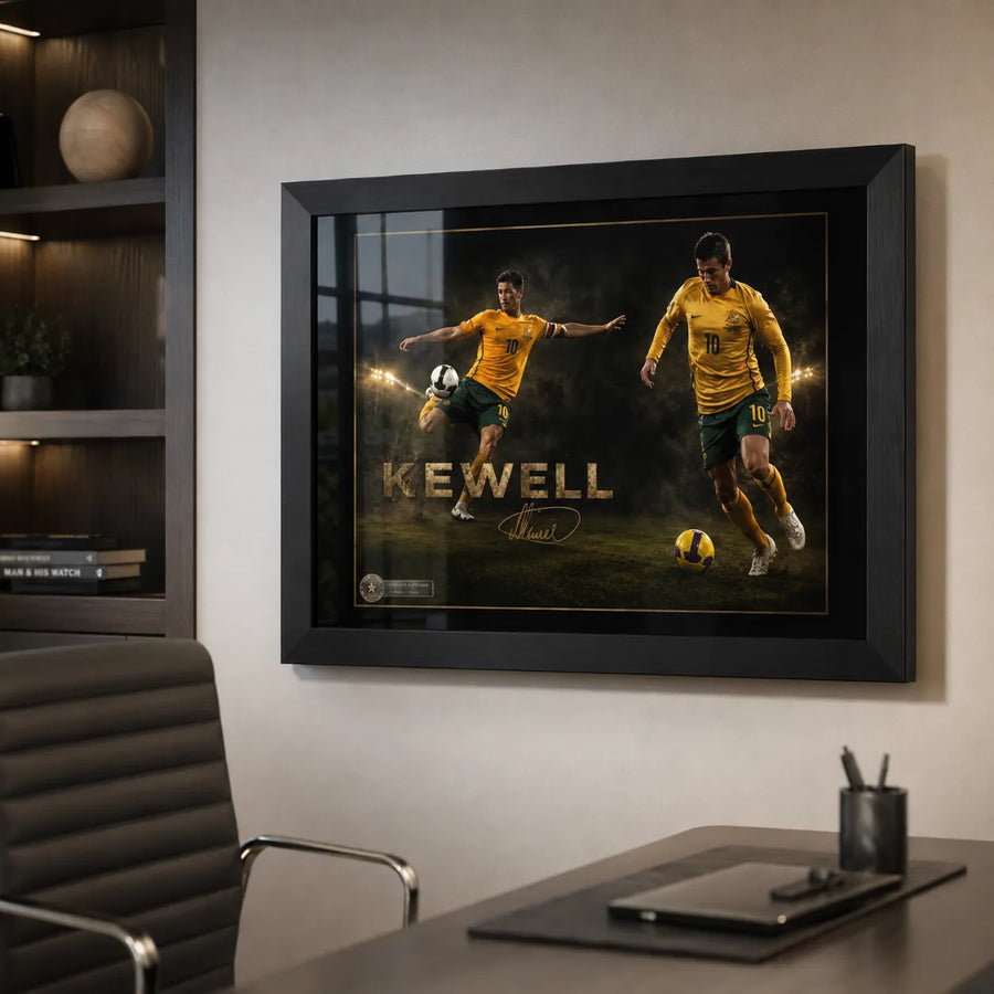 Harry Kewell soccer wall art displayed in a modern office with a black frame above a desk and black chair.