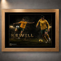 Oak framed Harry Kewell soccer wall art featuring two action poses in Australia colours on a dark stadium scene.