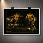 Unframed Harry Kewell soccer wall art print with a white border and hanging clips against a grey wall.
