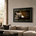 Jack Brabham motor racing wall art in a black frame displayed above a neutral living room sofa.