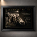 Jack Brabham 1959 motorsport wall art in a black frame, showing him pushing the number 1 race car beside his crew.