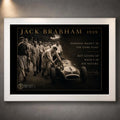Jack Brabham 1959 motorsport wall art in a white frame, featuring the historic car-pushing scene and collector details.