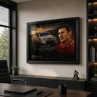 Black framed Jason Richards motorsport wall art displayed in a modern office above dark cabinetry and a timber desk.