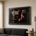 Jerry Rice wall art shown in a bright neutral living room with a black frame above a charcoal sofa.